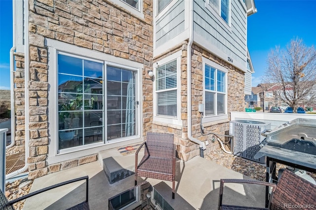 view of patio featuring cooling unit