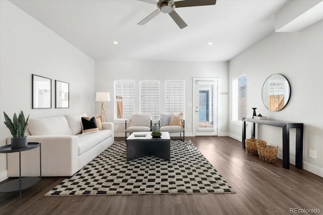 living room with plenty of natural light, baseboards, and wood finished floors