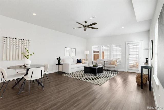 living area featuring visible vents, dark wood-type flooring, baseboards, recessed lighting, and a ceiling fan