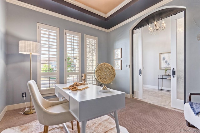 carpeted office with a raised ceiling, an inviting chandelier, and ornamental molding