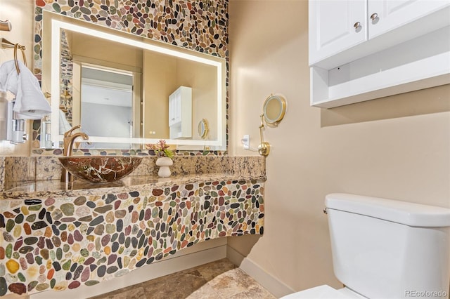 bathroom featuring sink and toilet