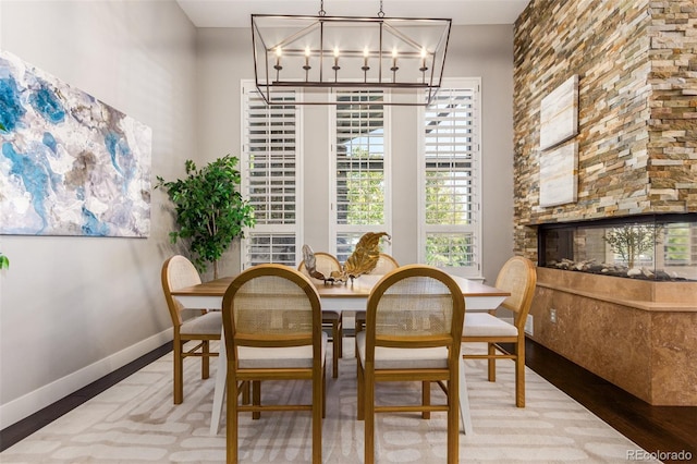 dining area with a notable chandelier and hardwood / wood-style floors