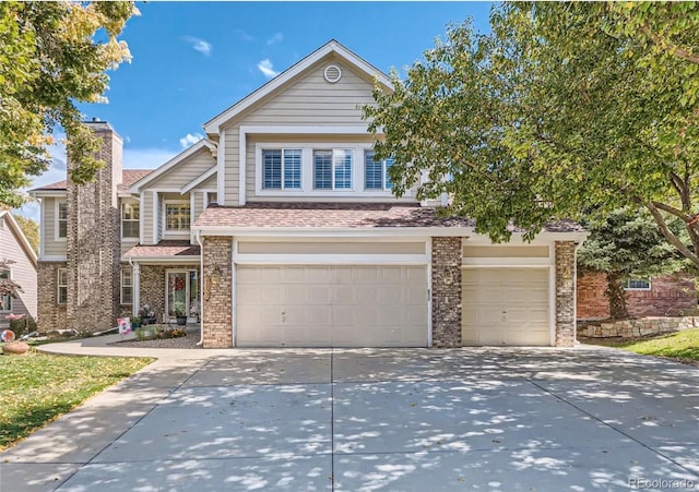 10032 Astoria Ct, Lone Tree, CO 80124 - view of front of house with an attached garage, concrete driveway, brick siding, and a shingled roof