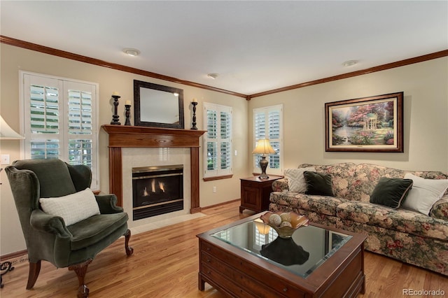 10032 Astoria Ct, Lone Tree, CO 80124 - living room featuring light wood-style flooring, healthy amount of natural light, ornamental molding, and a fireplace with flush hearth