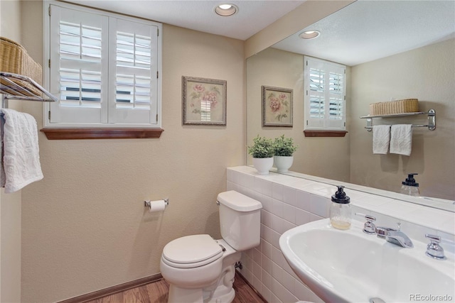 10032 Astoria Ct, Lone Tree, CO 80124 - bathroom featuring wood finished floors and recessed lighting