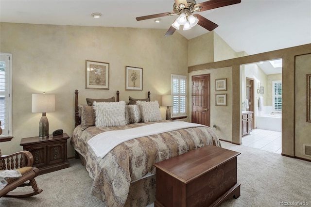 10032 Astoria Ct, Lone Tree, CO 80124 - bedroom with light colored carpet, vaulted ceiling, ensuite bath, ceiling fan, and light tile patterned flooring