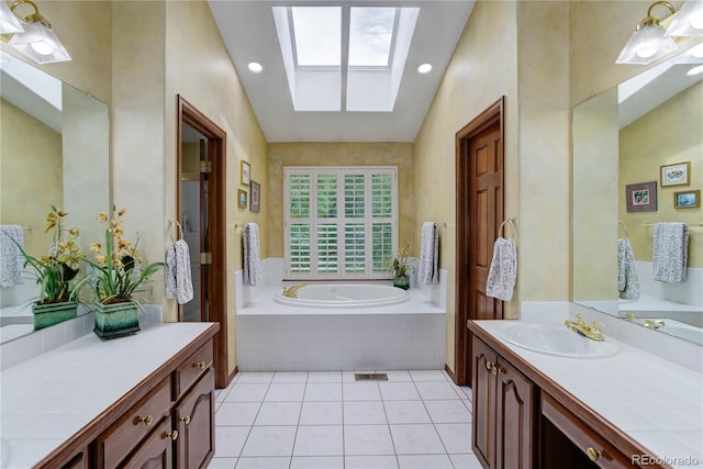10032 Astoria Ct, Lone Tree, CO 80124 - full bathroom with a skylight, vanity, a bath, tile patterned floors, and recessed lighting
