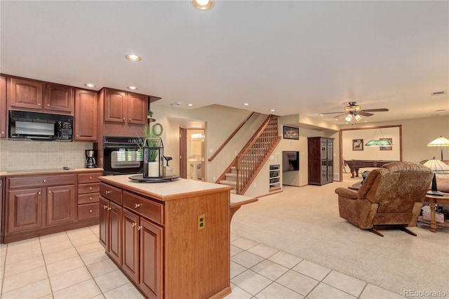 10032 Astoria Ct, Lone Tree, CO 80124 - kitchen featuring black appliances, light tile patterned floors, open floor plan, ceiling fan, and light colored carpet
