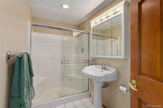 10032 Astoria Ct, Lone Tree, CO 80124 - bathroom featuring a stall shower and tile patterned floors