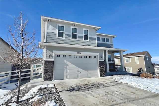 view of front of home featuring a garage and a porch