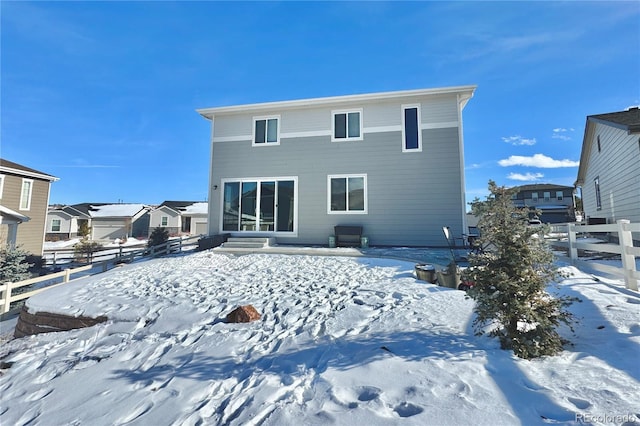 view of snow covered house