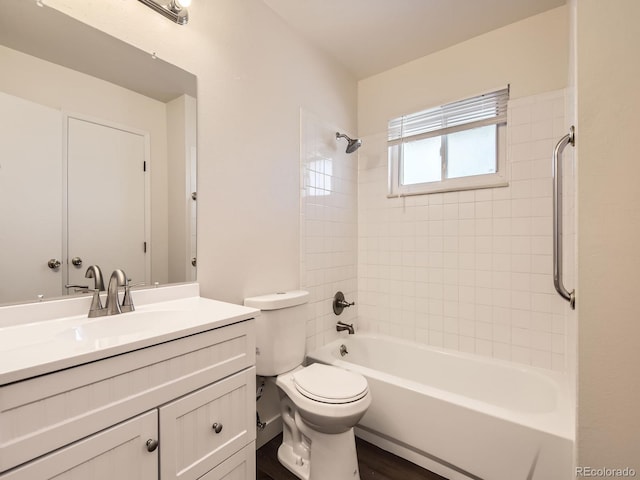 bathroom featuring vanity, toilet, and bathing tub / shower combination