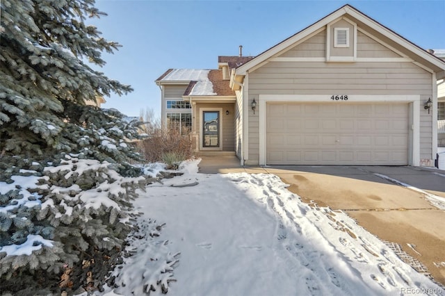 view of front of property with a garage