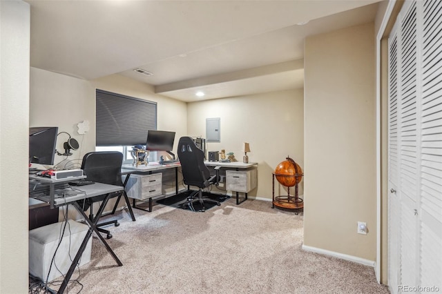 office space with electric panel and light colored carpet