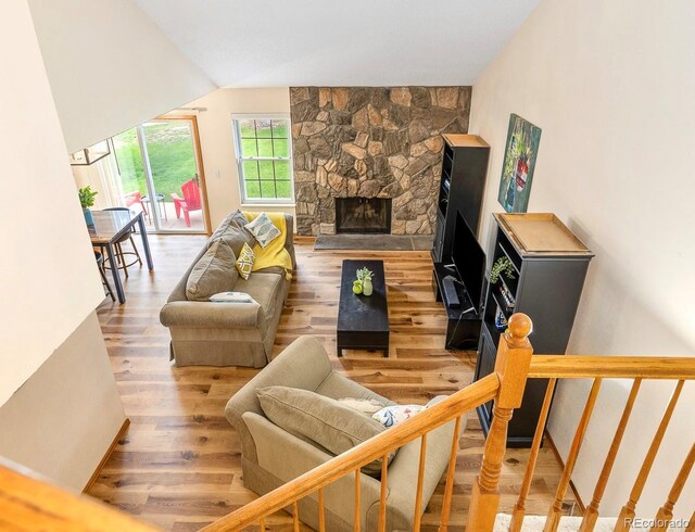 2650 S Vaughn Way Unit B, Aurora, CO 80014 - living area with wood finished floors and a fireplace