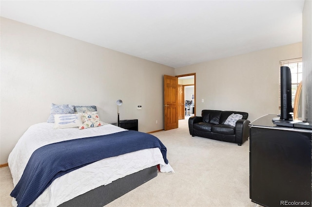 2650 S Vaughn Way Unit B, Aurora, CO 80014 - bedroom featuring light colored carpet and baseboards