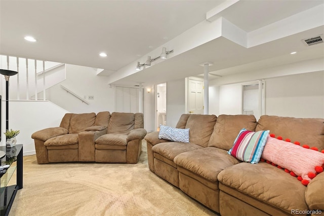 2650 S Vaughn Way Unit B, Aurora, CO 80014 - living area featuring light colored carpet, stairway, and recessed lighting