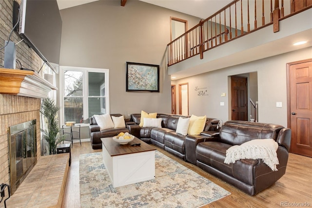 10059 Granite Hill Dr, Parker, CO 80134 - living room featuring stairway, a fireplace, high vaulted ceiling, and wood finished floors