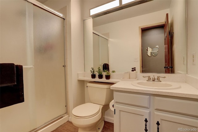 10059 Granite Hill Dr, Parker, CO 80134 - full bathroom with toilet, baseboards, a shower stall, vanity, and wood finished floors