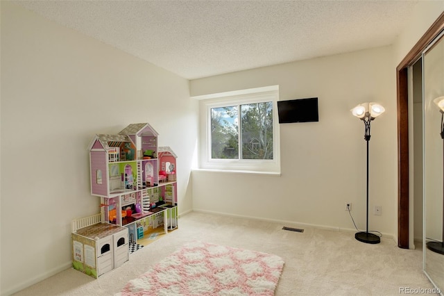 10059 Granite Hill Dr, Parker, CO 80134 - playroom with carpet flooring, a textured ceiling, visible vents, and baseboards