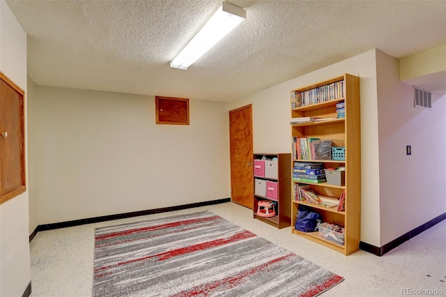 10059 Granite Hill Dr, Parker, CO 80134 - playroom with a textured ceiling, baseboards, and visible vents