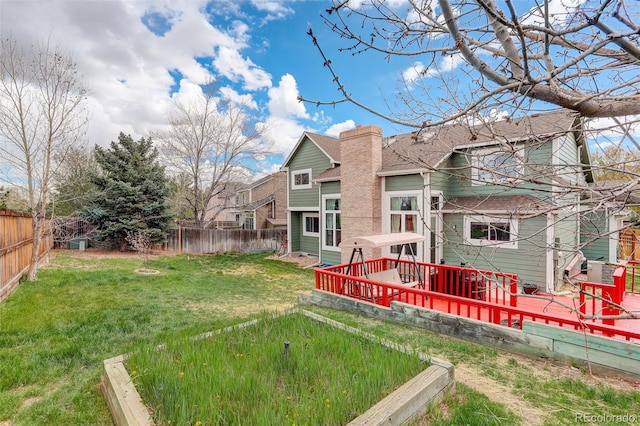 10059 Granite Hill Dr, Parker, CO 80134 - rear view of property with a fenced backyard, a wooden deck, a chimney, and a yard