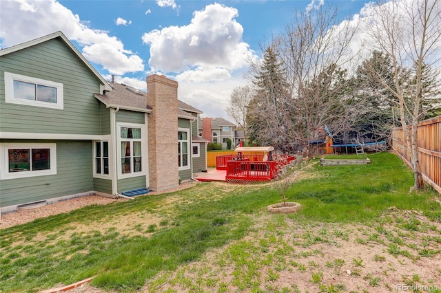 10059 Granite Hill Dr, Parker, CO 80134 - view of yard featuring a trampoline, a deck, and fence