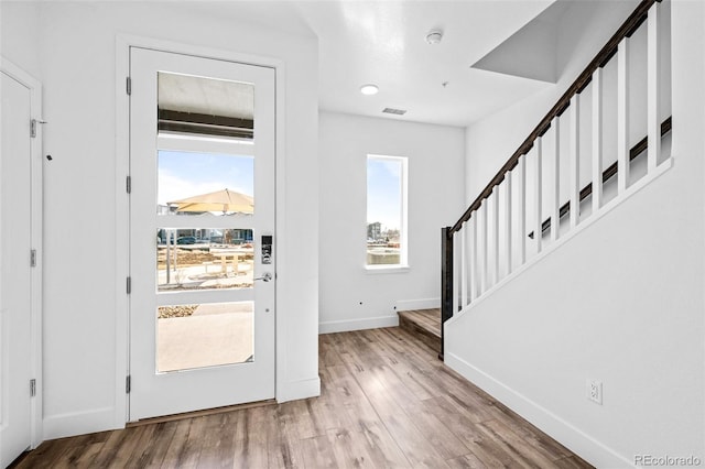 foyer entrance with light hardwood / wood-style flooring