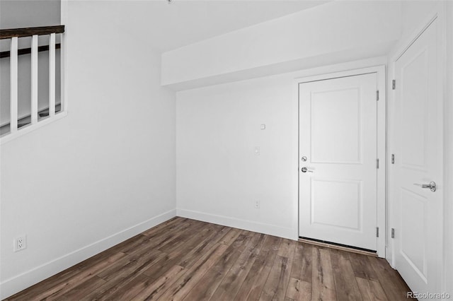 spare room with hardwood / wood-style floors