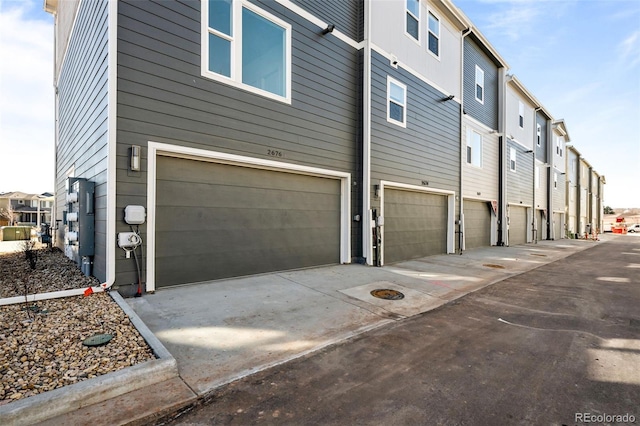 view of property exterior with a garage