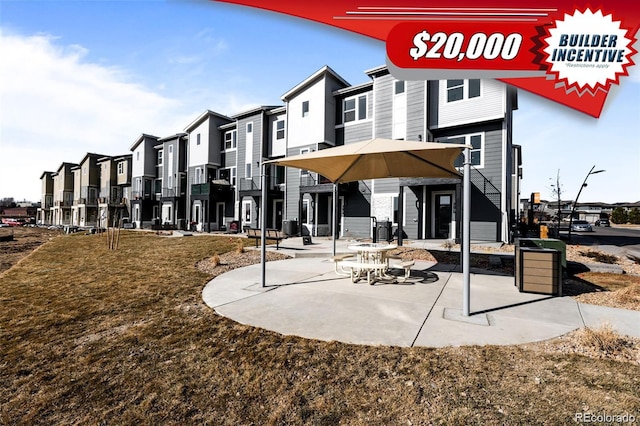 2676 W 68th Ave, Denver, CO 80221 - back of house featuring a residential view and a patio area