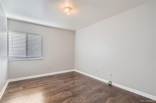 empty room featuring dark hardwood / wood-style floors