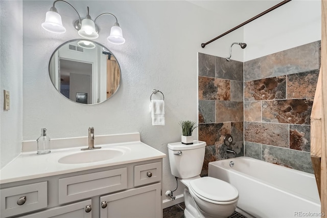 full bathroom featuring vanity, bathtub / shower combination, and toilet