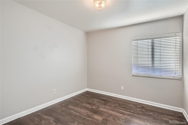 unfurnished room with dark hardwood / wood-style floors