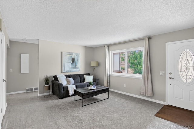 8721 W 86th Ave, Arvada, CO 80005 - carpeted living area with a textured ceiling