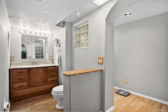 8721 W 86th Ave, Arvada, CO 80005 - bathroom featuring wood finished floors and vanity
