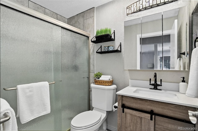 8721 W 86th Ave, Arvada, CO 80005 - full bath featuring vanity, a textured wall, and a shower stall