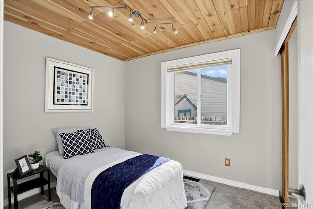 8721 W 86th Ave, Arvada, CO 80005 - bedroom with track lighting, carpet floors, and wooden ceiling