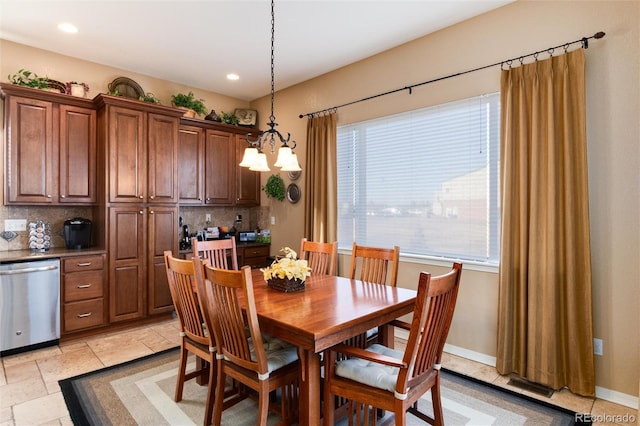 dining area with a notable chandelier