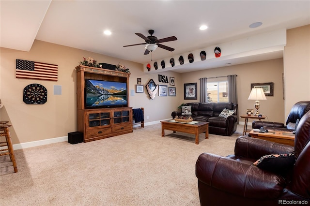 living room with ceiling fan and light colored carpet