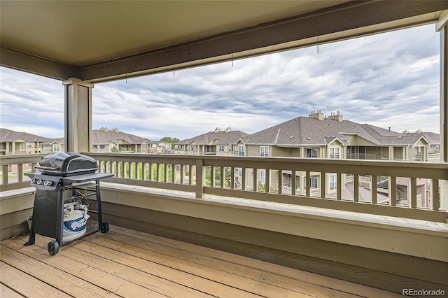 wooden terrace featuring area for grilling