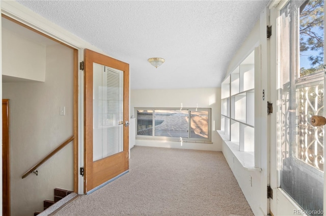 unfurnished sunroom featuring plenty of natural light