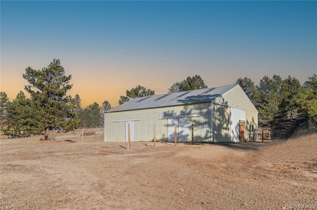 view of outdoor structure at dusk