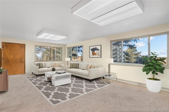 carpeted living room with plenty of natural light and a baseboard heating unit