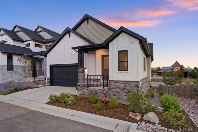 7022 Homeplace St, Castle Rock, CO 80108 - modern farmhouse featuring board and batten siding, stone siding, an attached garage, and concrete driveway