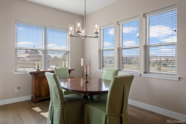 7022 Homeplace St, Castle Rock, CO 80108 - dining area with a chandelier, baseboards, and wood finished floors