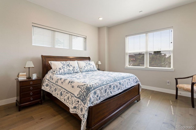 7022 Homeplace St, Castle Rock, CO 80108 - bedroom featuring baseboards, hardwood / wood-style floors, multiple windows, and recessed lighting