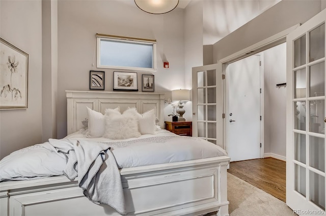 bedroom with light hardwood / wood-style flooring