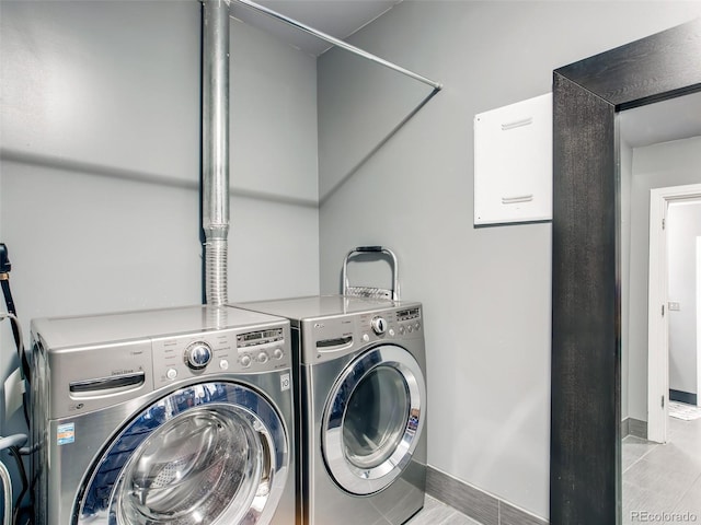 washroom with independent washer and dryer