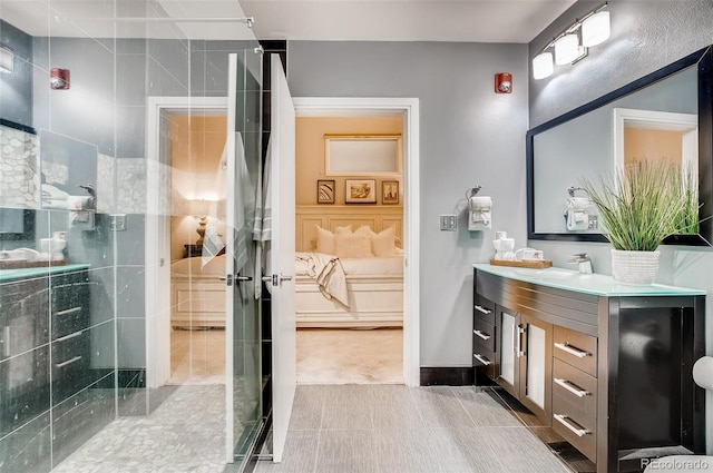 bathroom with vanity, a shower with shower door, and tile patterned floors